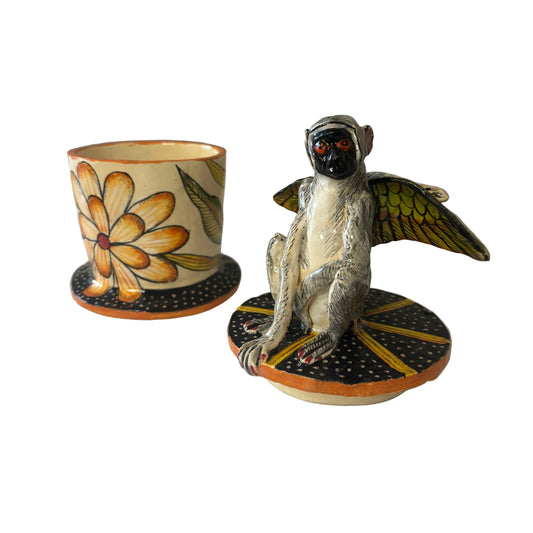 A playful meeting of art, nature and imagination, this handcrafted ceramic trinket box is topped with a wonderfully expressive winged monkey, bringing an unexpected touch of whimsy to the piece.