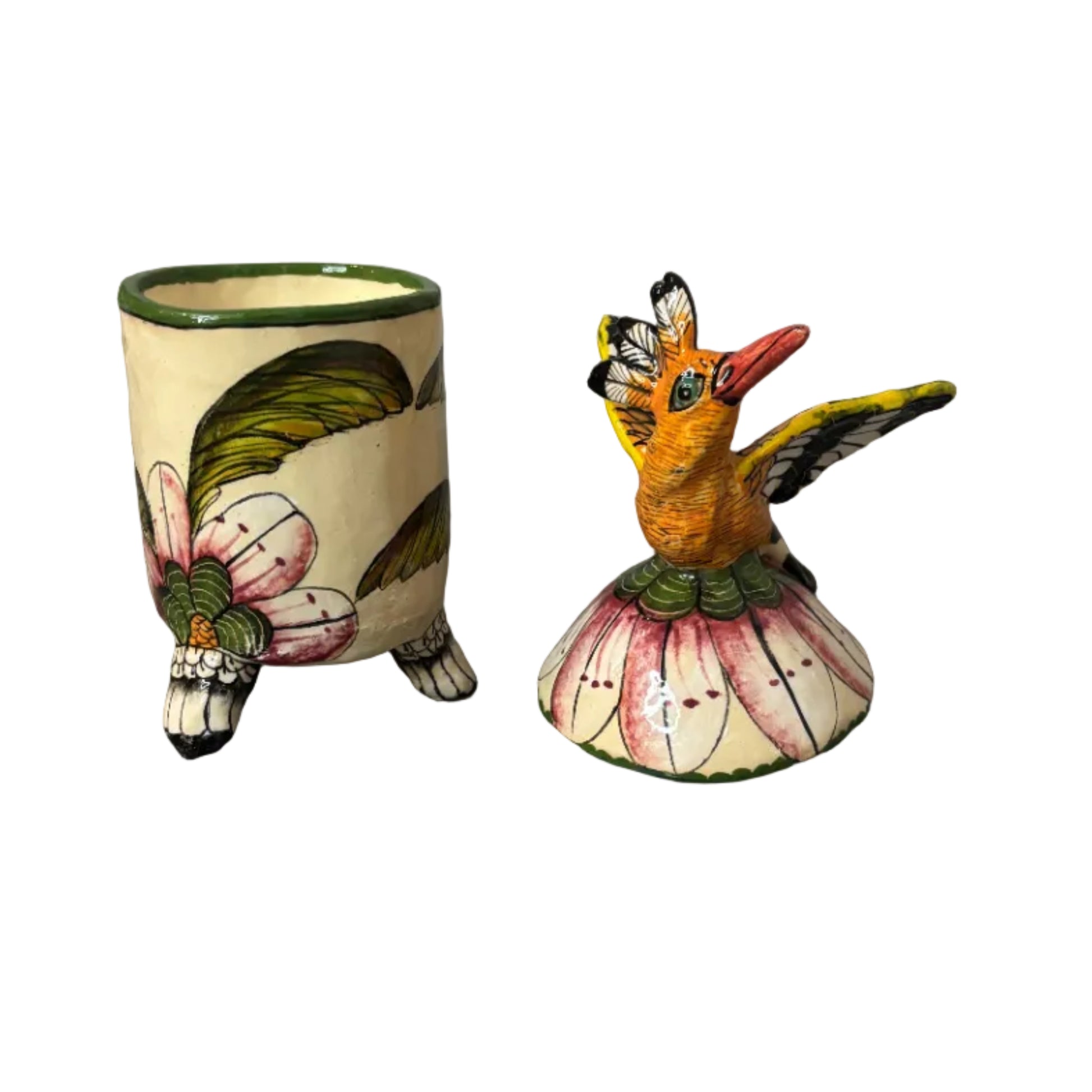 Decorative container with a lid. Atop the lid sits a bird.  Hand painted florals. Ceramic art. Scented candle inside. 