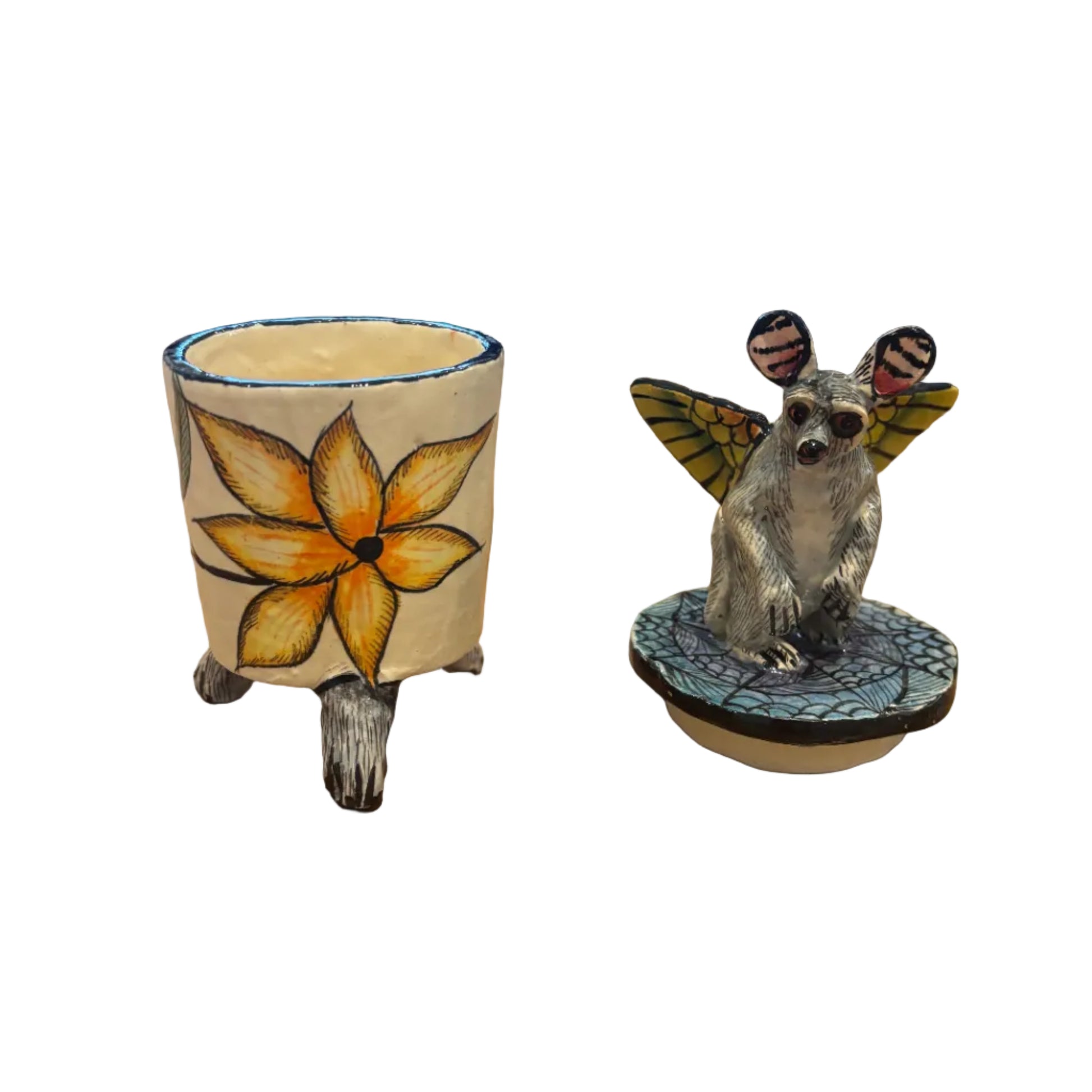 Handcrafted ceramic trinket box features a whimsical bushbaby perched atop the lid, complete with beautifully painted butterfly wings.