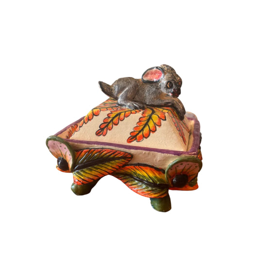 Decorative item with a hare on the top. 